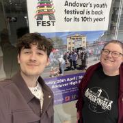 Dmitrijs and Katherine, co-organisers of A-Fest, with an A-Fest poster in the Chantry Centre