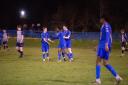 Andover Town players celebrate after scoring their first goal against Millbrook