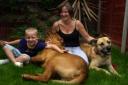 Emma Davis with son Mark and dogs Blade (left) and Chelsea (right)