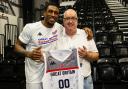 Former Love Island contestant and GB basketball star Ovie Soko presents Andrew Cattle with a signed shirt to be auctioned off for charity