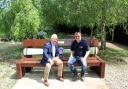 General Sir Gary Coward (left) and David Mitchell, director of UK Power Networks Services, on a bench staff designed and made for Army Flying Museum.