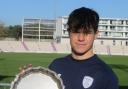 Sam Ashman is pictured with the Peter Lewin Memorial Trophy awarded annually to the top county Under-15 player.