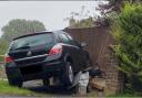 Vauxhall crashes into residential fence and telecoms box on major Andover road