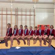 The Red Hot Gym Club girls with their medals