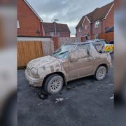 This muddy car was seized by police.