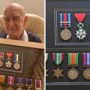 Veteran Rusty brought his medals along to show residents.
