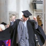 Martin celebrating after receiving his BA in Creative Writing at November's University of Winchester graduation ceremony