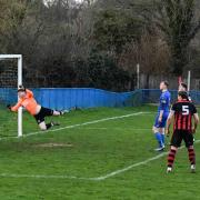 Romsey's third goal hits the back of the net