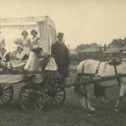 A horse-drawn carnival float in the Walled Meadow during the 1930s