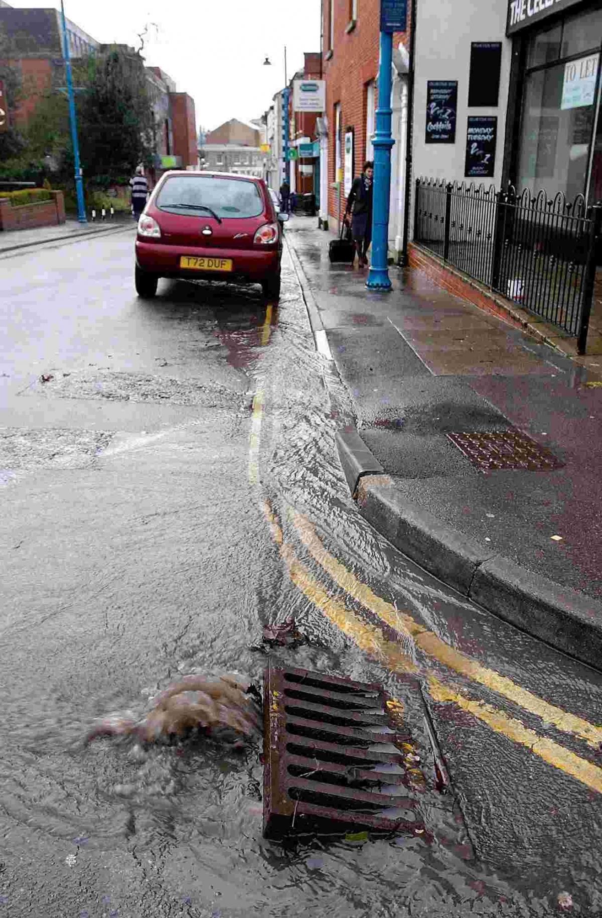 London Streets drains struggle to cope after heavy rain on Thursday 10 January 2007