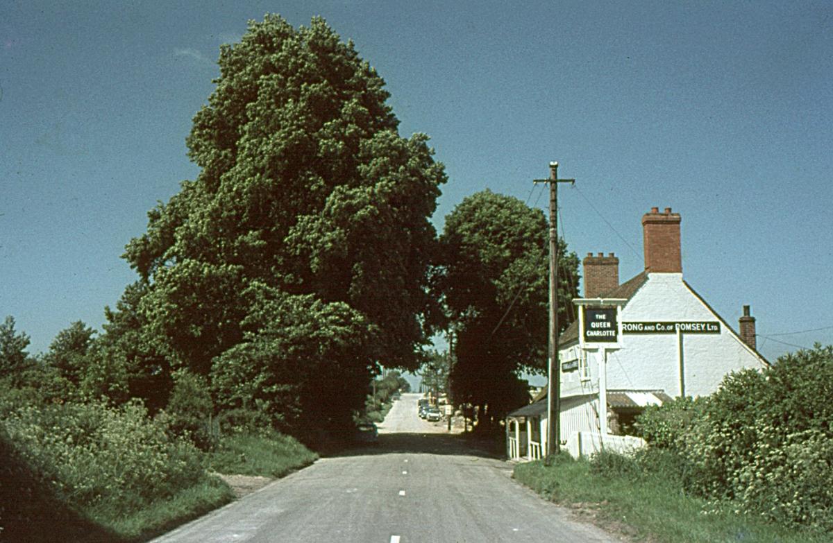 The Queen Charlotte on the London Road to Whitchurch. Turn left out of  the pub and drive straight to Whitchurch. A quiet rural idyll. From the Jeffery Saunders collection.