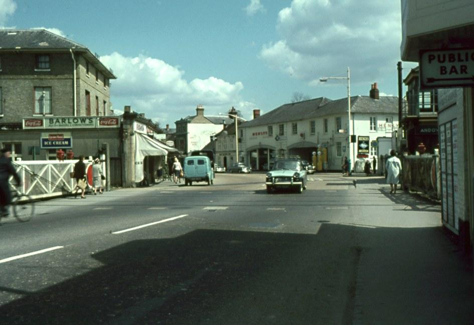 Bridge Street (A303) facing east with the Andover Town Station level crossing and Henlys Garage (BMC dealership) in view.

Picture for the Jeffrey Saunders collection