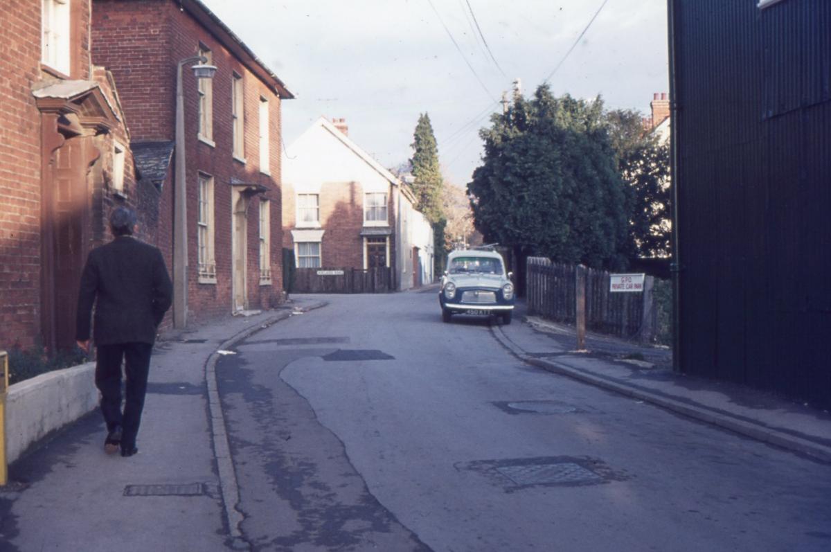 Eastfield Road looking east.  The houses to the left since demolished to make way for Rack Close flats.  The Drill Hall on the right (which in the 70s became the Country Bumpkin Club, which in turn was destroyed by fire in the 80s - today the site of a se