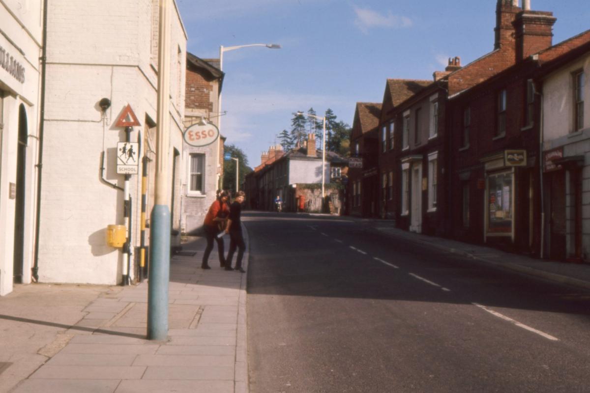 London Street when it was the A303 and was not interrupted by an inner ring road (as today). The old style school warning triangle (right by where Herbies Pizza is) was for East Street school. An era before double yellow lines too!

Picture from the Jef