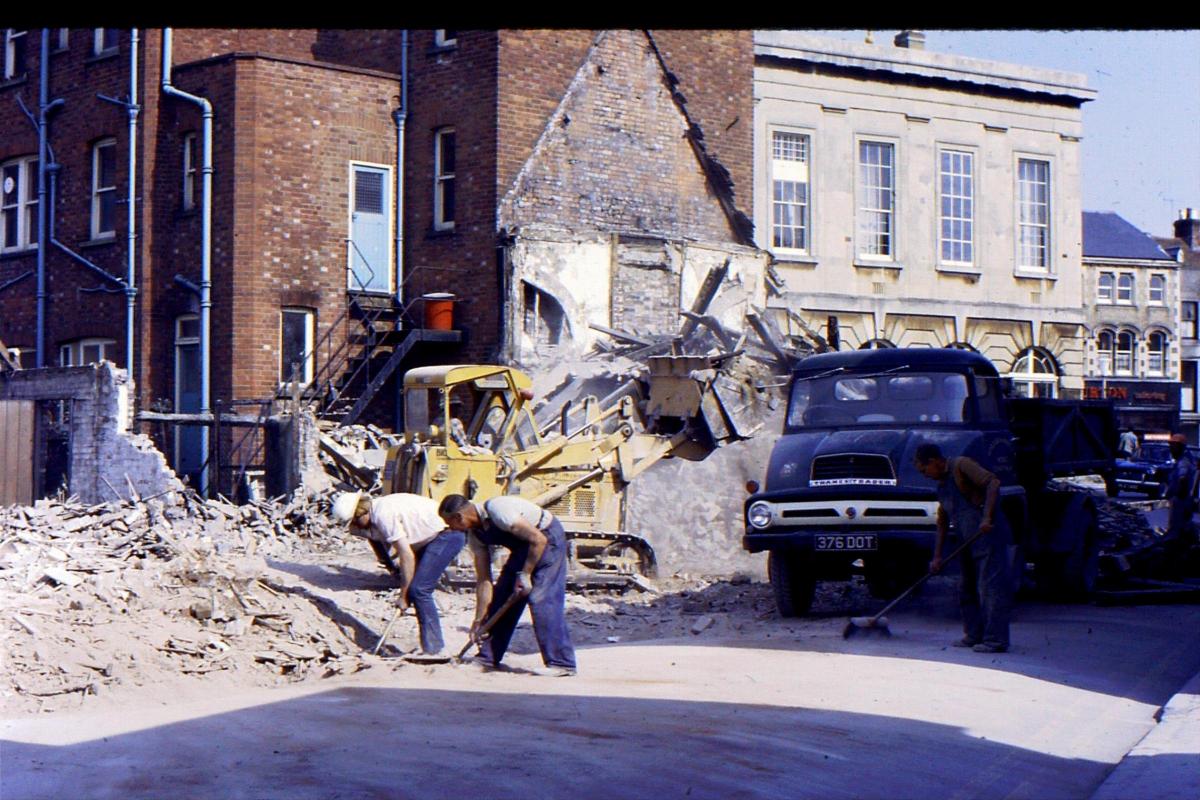 The start of demolition of shops behind the Guildhall.  Today the site of the entrance to Chantry Centre.

Picture from the Jeffrey Saunders collection.
