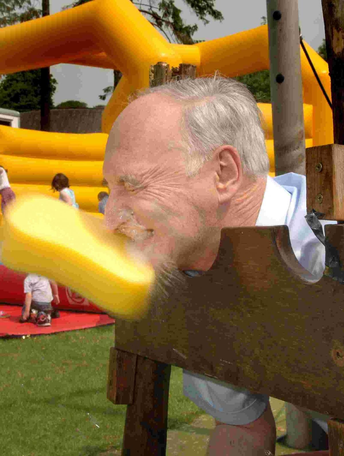 Sir George Young, former North West Hants MP gracefully receiving a wet sponge at the Hurstbourne Tarrant Fete in 2007 