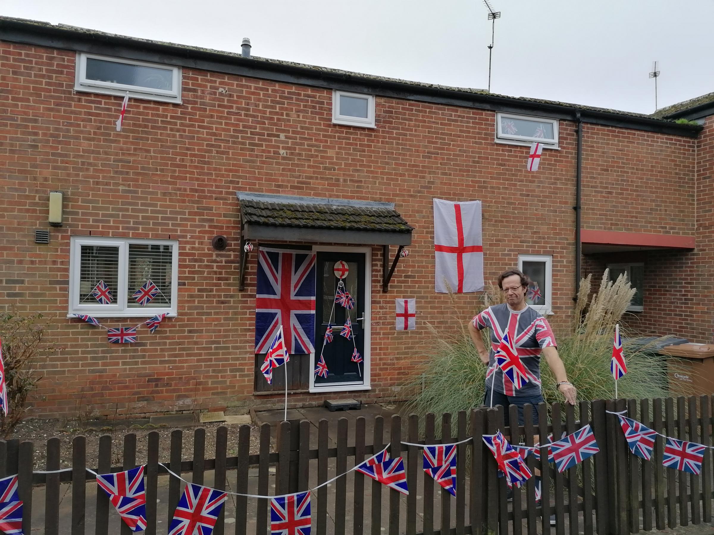 Bernie Lucker has decorated the front of his house in Union Jacks to pay tribute to Captain Sir Tom Moore.