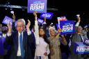 Michael Gove (left), Rishi Sunak's wife Akshata Murthy (centre left ), mother Usha Sunak (centre right) and father Yashvir Sunak (right) cheer Rishi Sunak during a hustings event at Wembley Arena, London, as part of the campaign to be leader of the