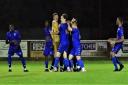 Andover Town celebrate after their penalty shootout win against Fareham.