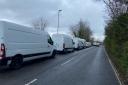 The vans parked along Lister Road