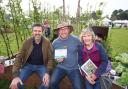 Gardeners World presenter Adam Frost, Boaz head of horticulture Andy Brooks and Boaz volunteer Heather Watson
