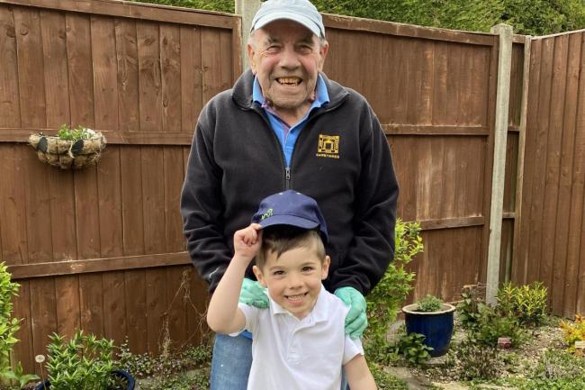 John Hanson School caretaker Mick Coster, with his grandson Alfie, 5.