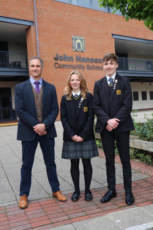 Andover Advertiser: Maddie Day, head girl, and Edward Hornby, head boy, with headteacher Russell Stevens
