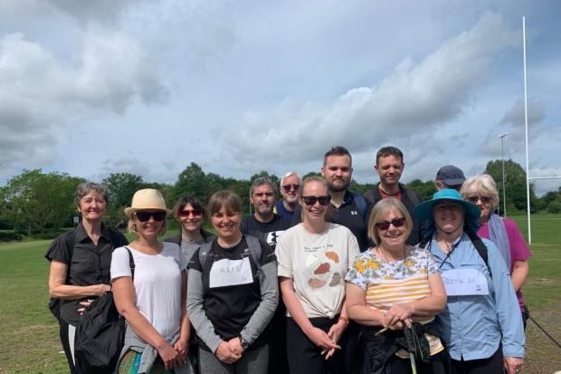 group of people from across Hampshire with a connection to mental distress walking 12 km along the River Itchen in aid of Soteria Network UK charity to spread awareness and to raise funds.