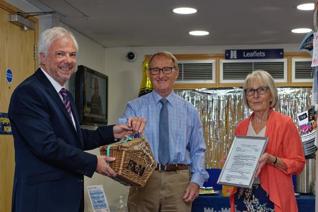 Senior Branch Manager, Cliff Osborne, giving a hamper to the branch’s first ever mortgage customers, Mr and Mrs Colbourne | Picture via Michael Harden Photography