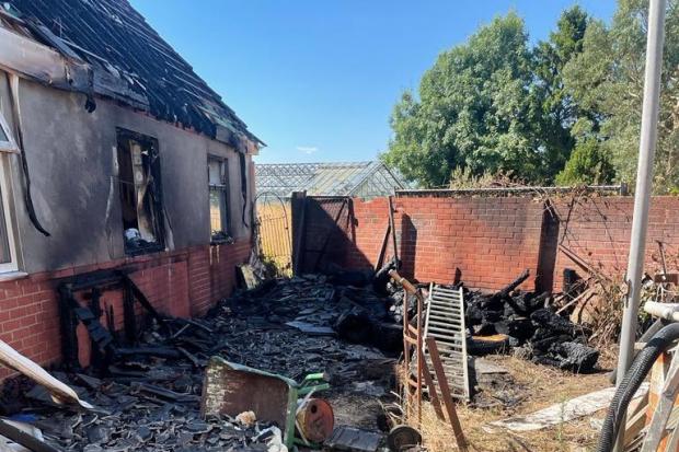 A bonfire spread to an adjoining garage at Sway Road, Pennington. Picture: Hampshire and Isle of Wight Fire and Rescue Service.