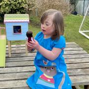 Rosie Barnett with the Lottie Dolls toy that is inspired by her. Credit: PA