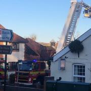 Firefighters at the spot of fire in Overton
