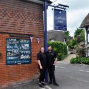 Shane Wells and Georgie Littler in front of Clatford Arms pub