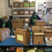 Foodbank volunteers pack food boxes