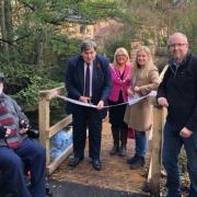 Kit Malthouse MP opens the bridge with members of the Whitchurch Conservation Group