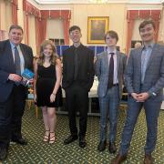 Kit Malthouse MP, with 2022 entrants Freya Hope, Felipe La Rocca, Jack Waue, and Dmitrijs Meiksans.