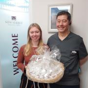 New Street Dental Care receiving their thank you jars from Manuela Wahnon
