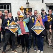 Liberal Democrat party members celebrate after their election campaign