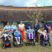 Naomi and David with staff, children and young adults at Naomi House & Jacksplace
