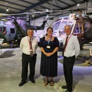 Army Flying Museum chief executive Lucy Johnson with staff from UK Power Networks Services