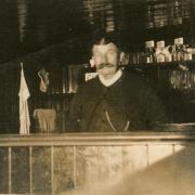 John (Jack) Culling behind the bar of the Rose and Chequers Inn