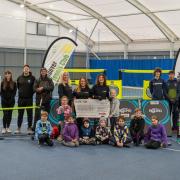 The Jamie G Sporting Trust's Jacqui Gentleman presents a cheque to Andover Lawn Tennis Club members