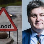 Flood warning sign and MP Kit Malthouse