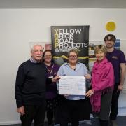 Bill Baughen and Cllr Zilliah Brooks present cheque to Yellow Brick Road Project