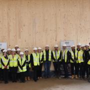 Teachers and pupils from the school met with representatives from Morgan Sindall and stakeholders to sign the timber frame at Winton Community Academy