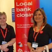 Leslie Francis and Debbie Morgan helping customers in Barclays Andover ahead of its closure