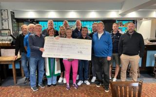 Local golfers at the Clatford Arms with the giant cheque