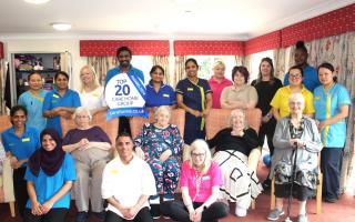 Residents and staff at Ashbourne Court Care Home celebrate the award